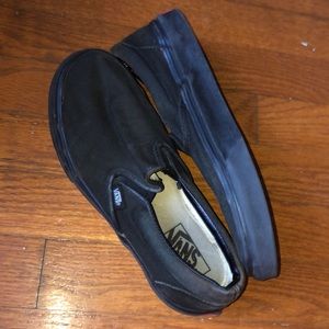 All black slip on vans